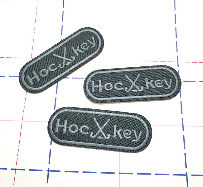 332 Термоаппликация 7,7*2,7см Овал Хоккей серый