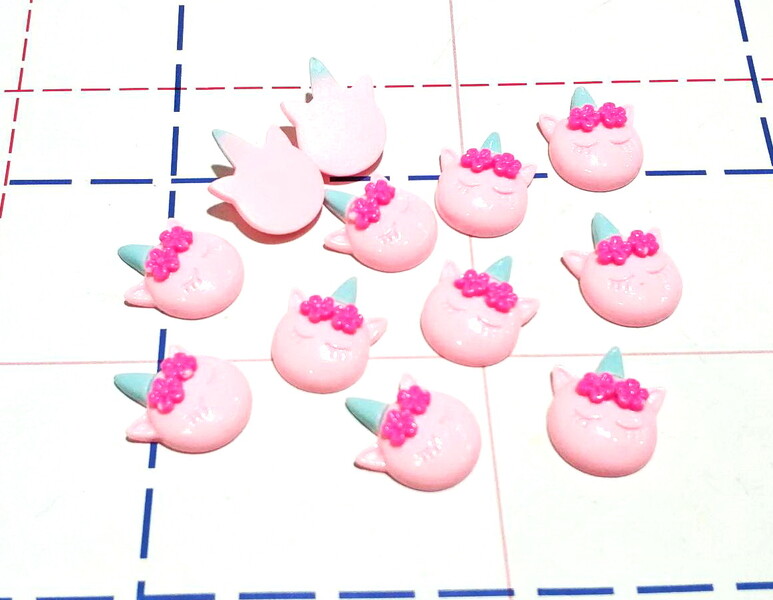 341 Кабошон Единорог 15*22мм розовый